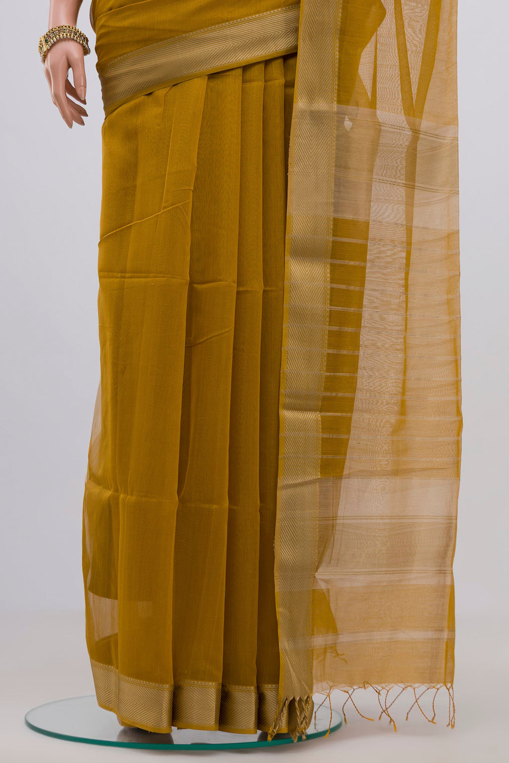 Pleats and pallu of Mustard Maheshwari Silk Cotton Saree with Plain Body and Thread Border. 