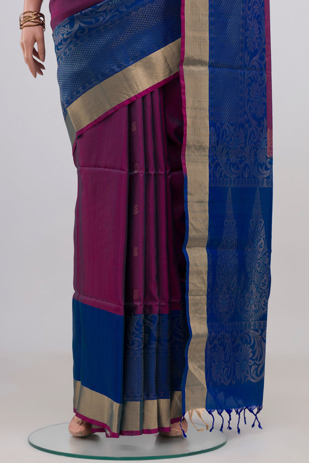 Pleats and pallu of Purple Soft Silk Saree with Zari Butta on the body and Fancy Border. 