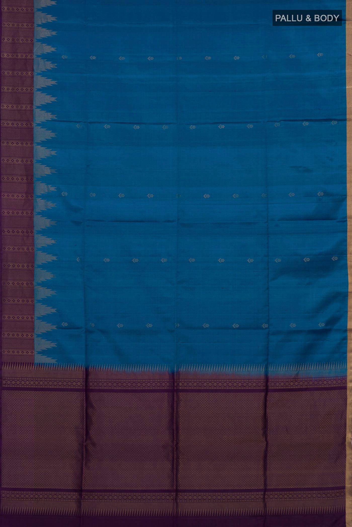 Flat view of Blue Soft Silk Saree with Zari Butta on the body and Fancy Border. 