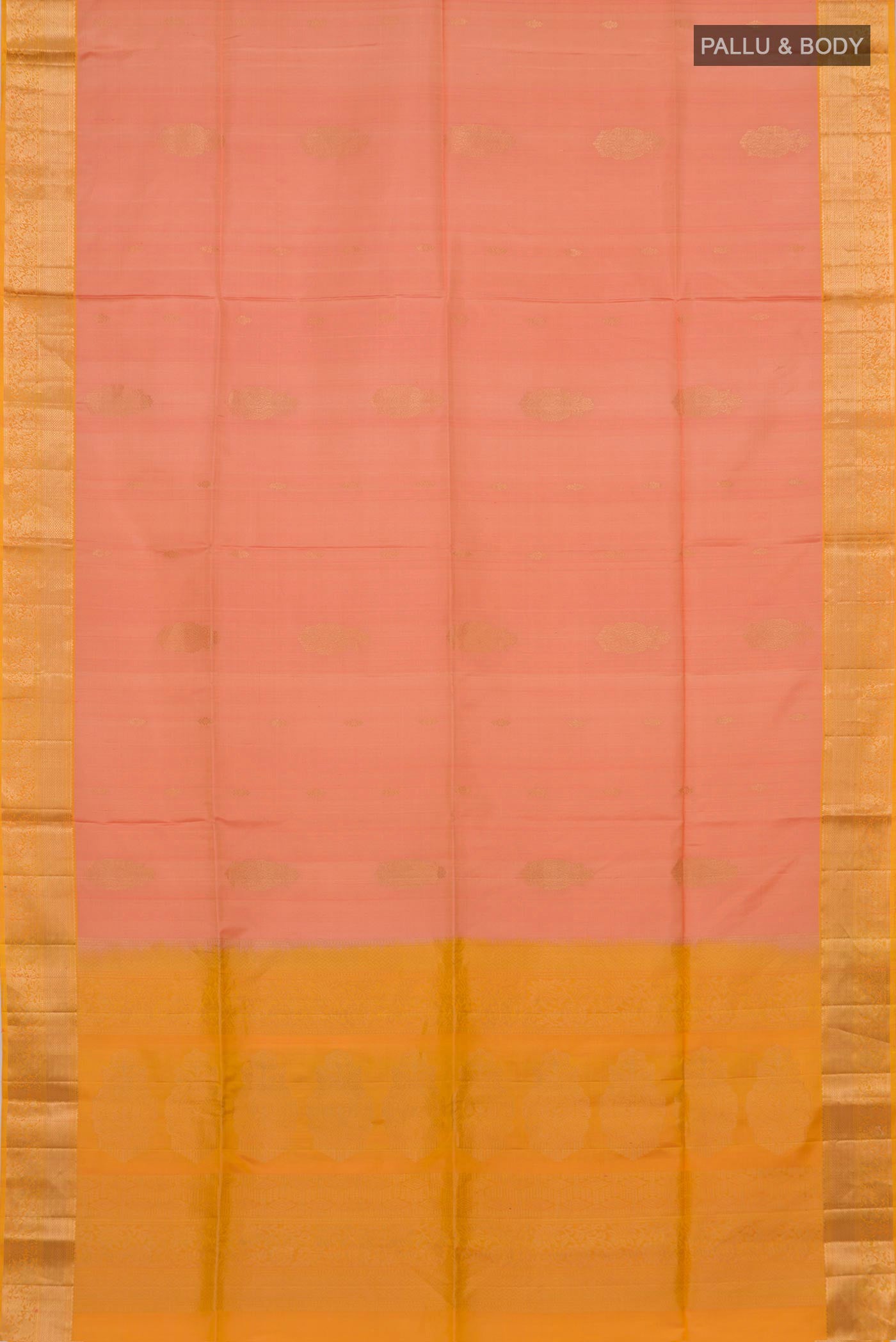 Flat view of Peach Soft Silk Saree with Zari Butta on the body and Zari Border. 