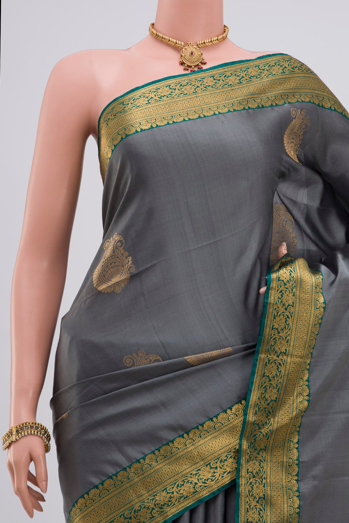 Border image of Grey Soft Silk Saree with Zari Butta on the body and Zari Border. 
