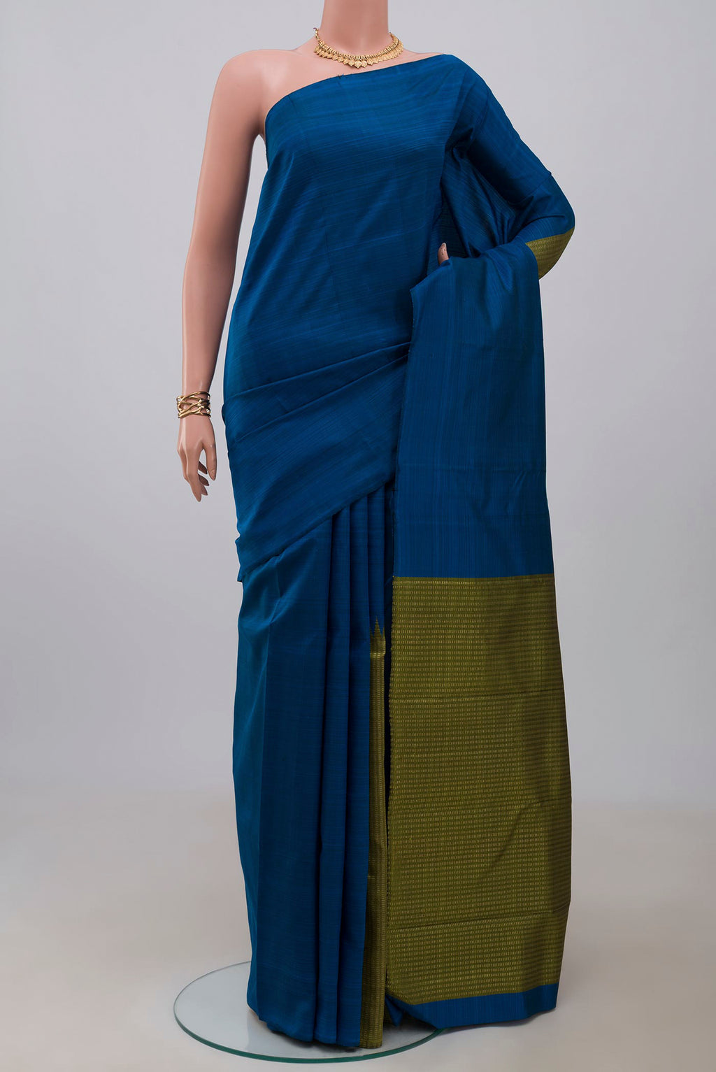 Pure Silk Pure Zari Blue Kanjivaram Saree with Fancy on the body and Without Border.  displayed on a mannequin