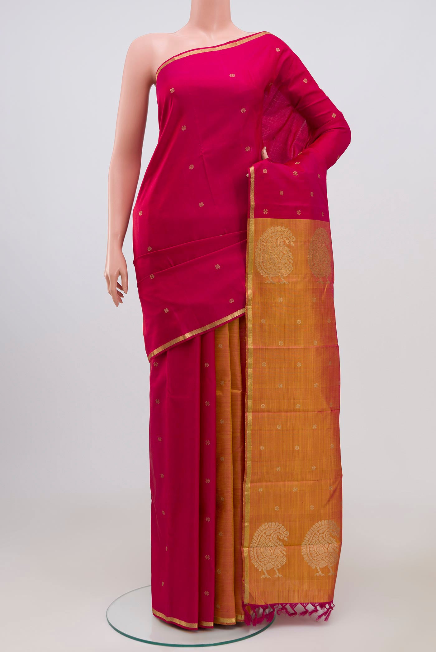 Pure Silk Pure Zari Multi Color Kanchipuram Saree with Zari Butta on the body and Thin Zari Line.  displayed on a mannequin