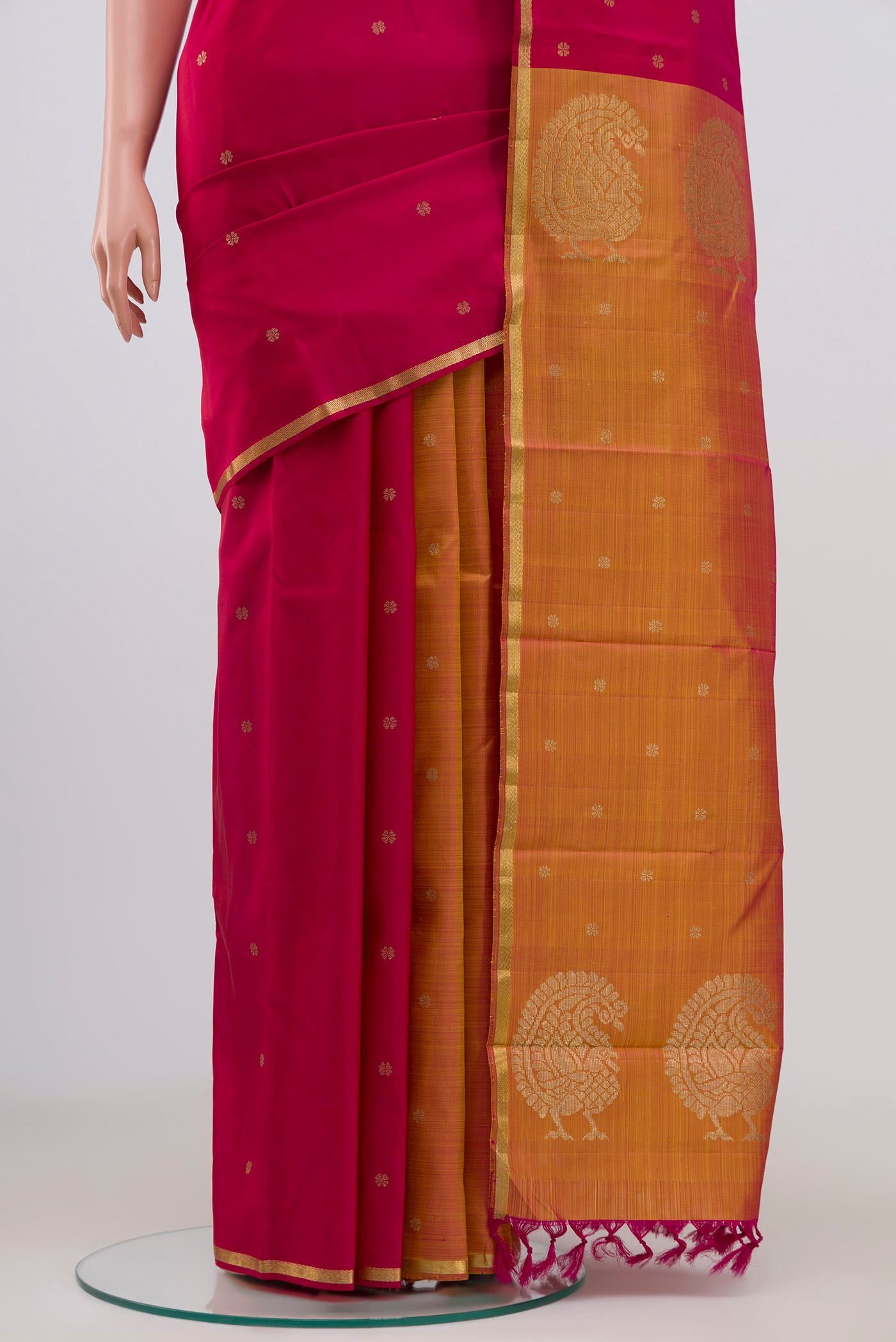 Pleats and pallu of Pure Silk Pure Zari Multi Color Kanchipuram Saree with Zari Butta on the body and Thin Zari Line. 