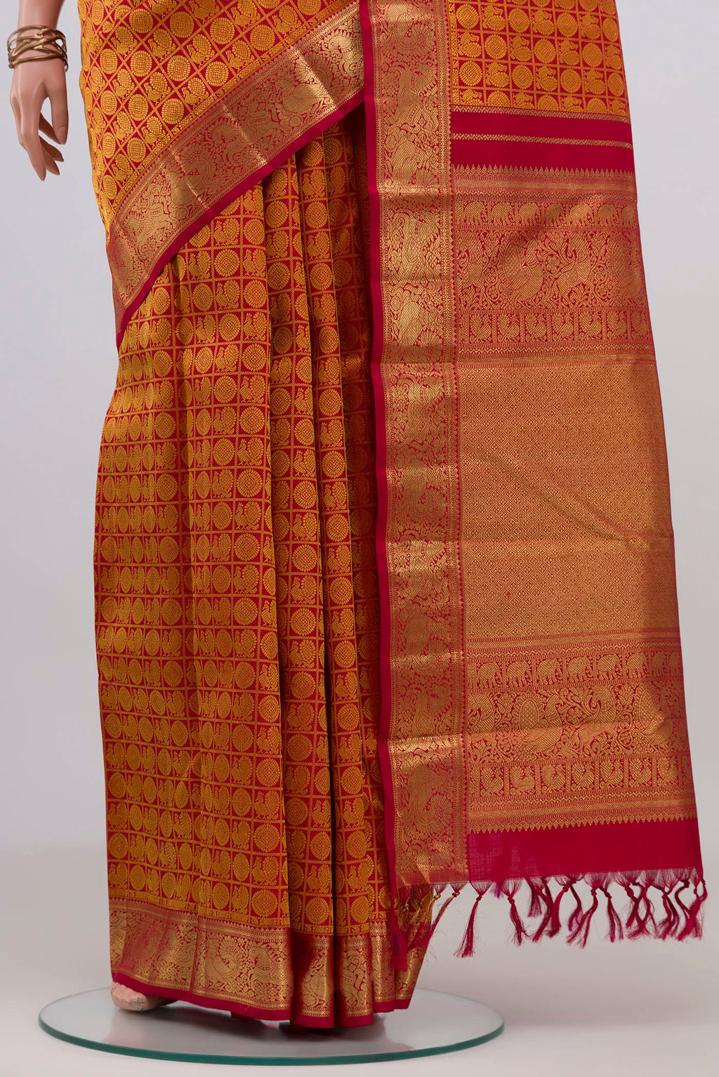 Pleats and pallu of Maroon Kanjivaram Silk Saree with Jacquard design on the body and Zari Border. 