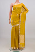 Pure Silk Yellow Banarasi Katan Saree with Zari Butta on the body and Zari Border.  displayed on a mannequin
