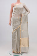 Grey Banarasi Katan Silk Saree with Zari Butta on the body and Zari Border.  displayed on a mannequin