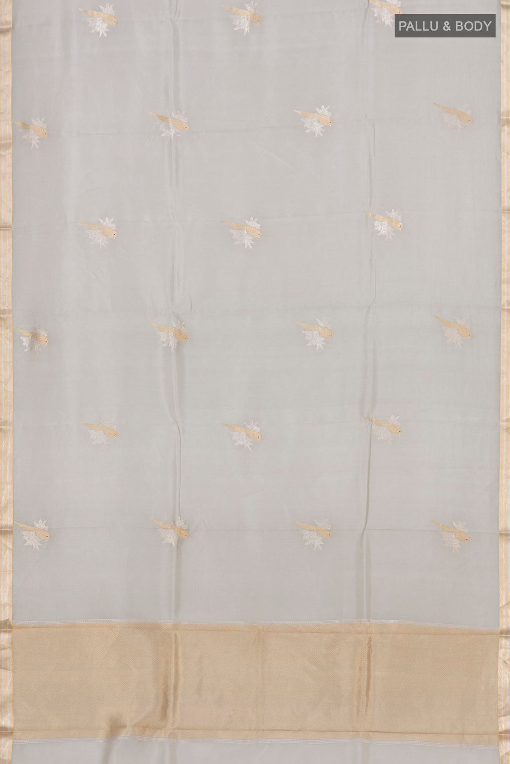 Flat view of Grey Banarasi Katan Silk Saree with Zari Butta on the body and Zari Border. 