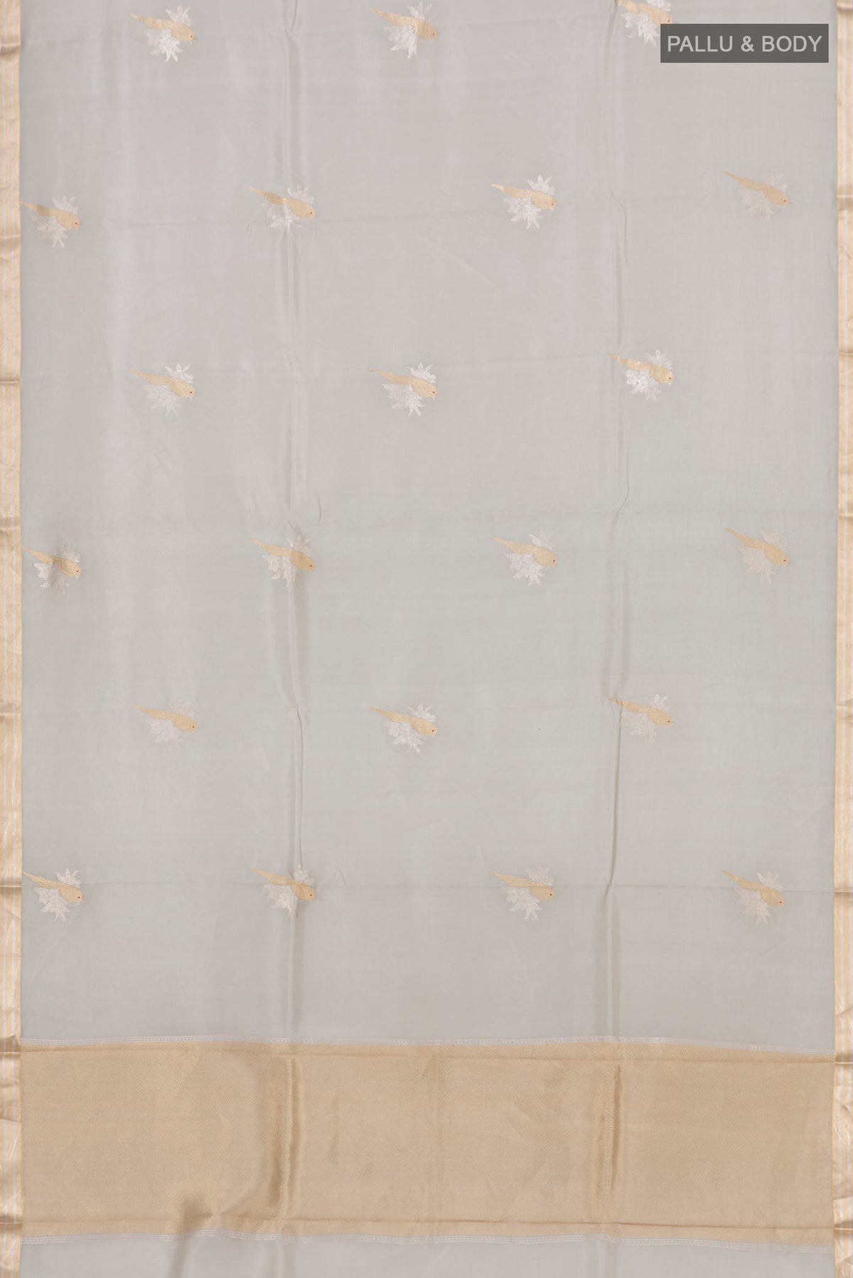 Flat view of Grey Banarasi Katan Silk Saree with Zari Butta on the body and Zari Border. 