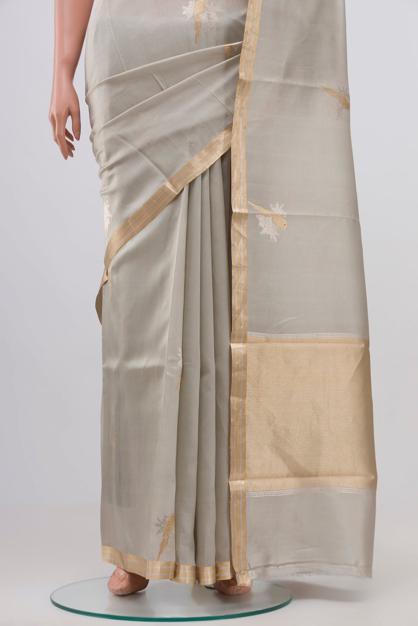 Pleats and pallu of Grey Banarasi Katan Silk Saree with Zari Butta on the body and Zari Border. 