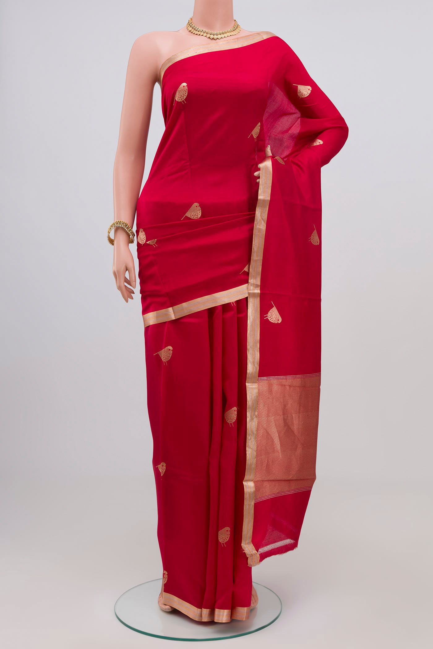 Red Banarasi Katan Silk Saree with Zari Butta on the body and Zari Border.  displayed on a mannequin