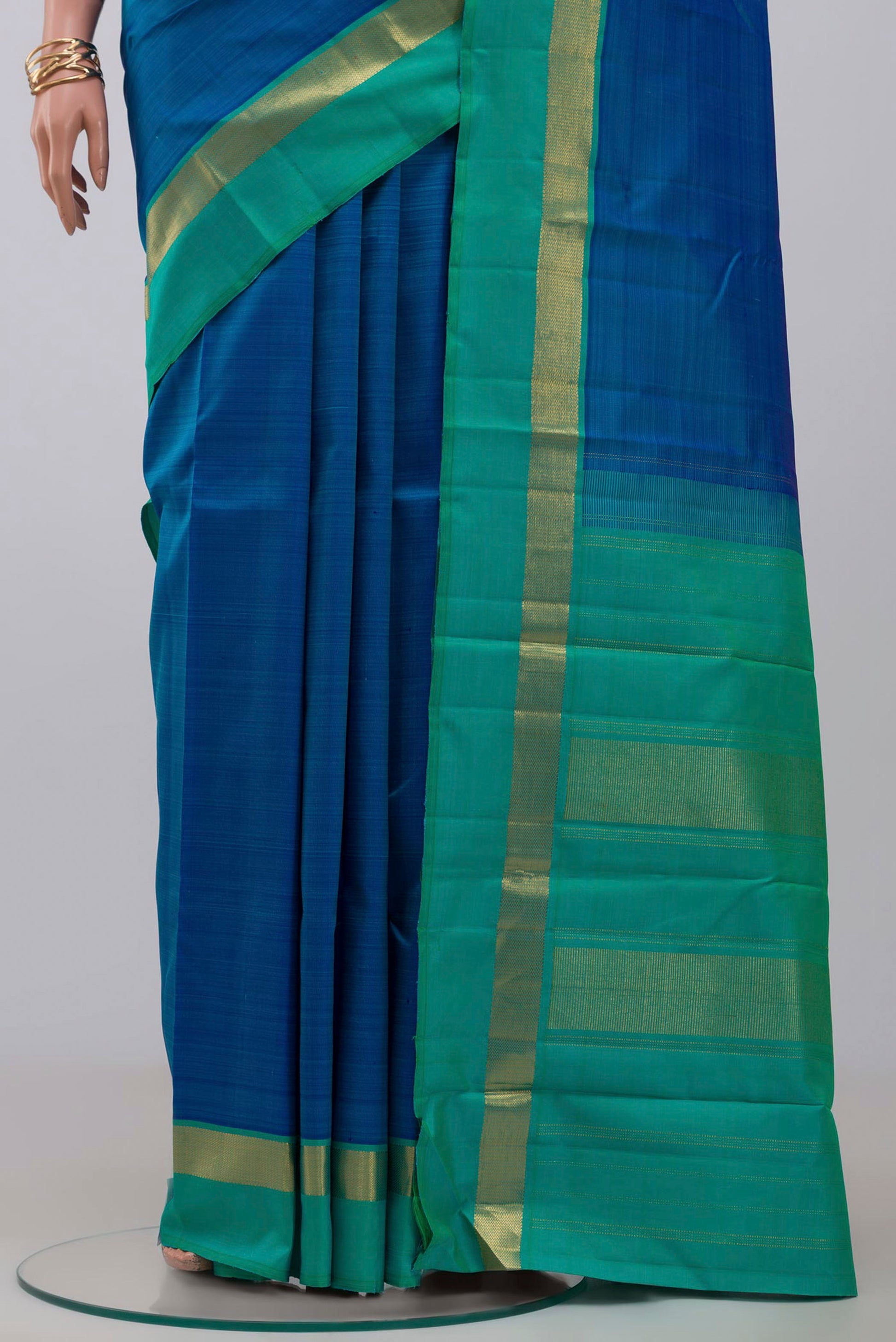 Pleats and pallu of Pure Silk Pure Zari Blue Kanjivaram Saree with Plain Body and Zari Border. 