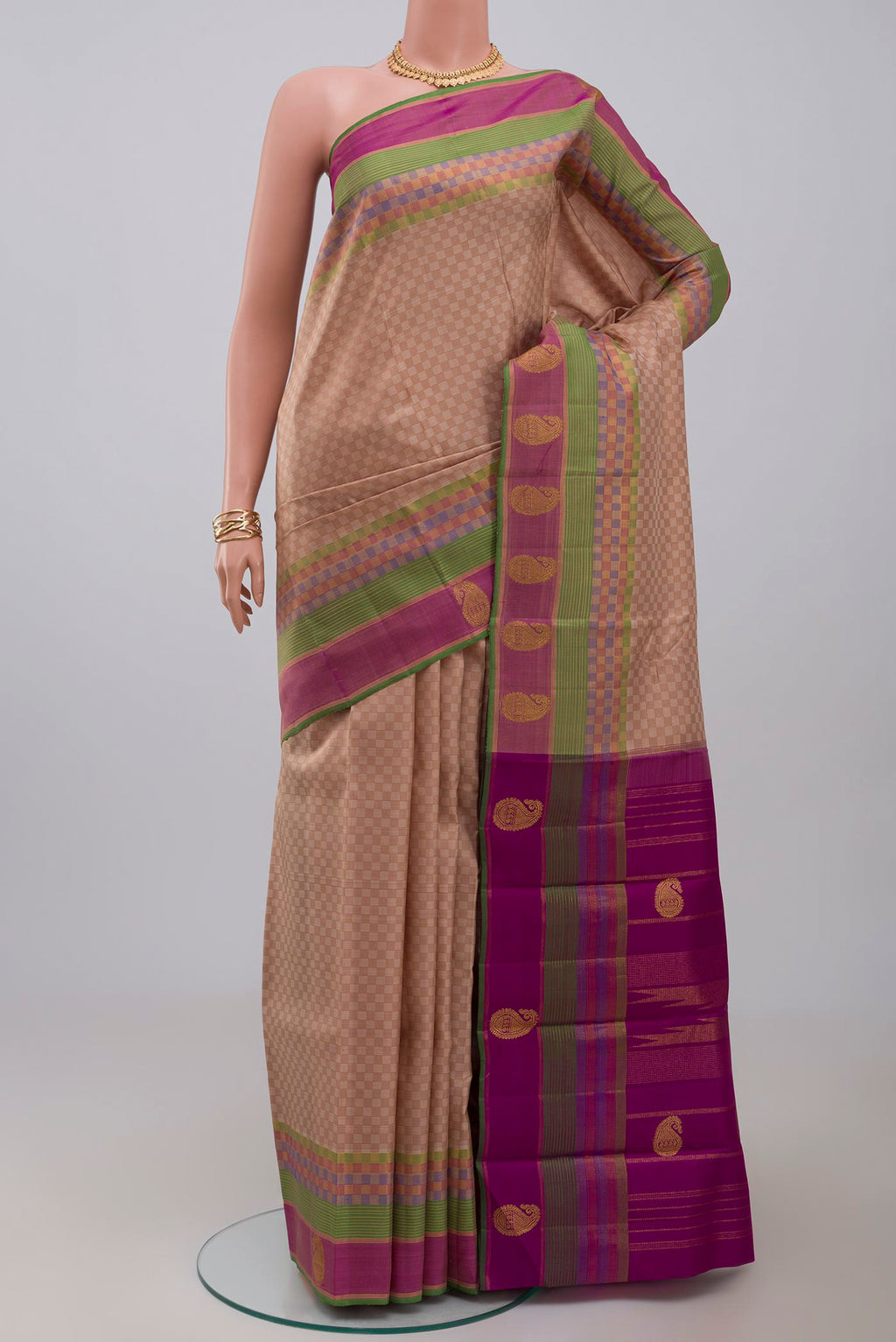 Pure Silk Pure Zari Beige Kanjivaram Saree with Checked design on the body and Zari Border.  displayed on a mannequin
