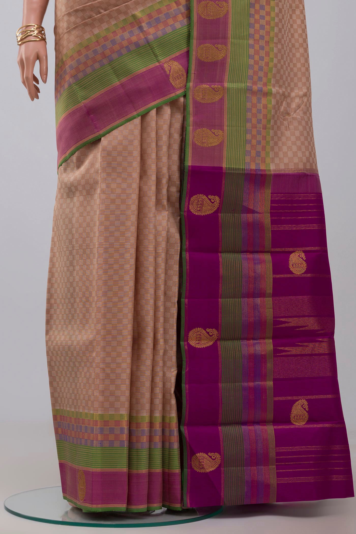 Pleats and pallu of Pure Silk Pure Zari Beige Kanjivaram Saree with Checked design on the body and Zari Border. 
