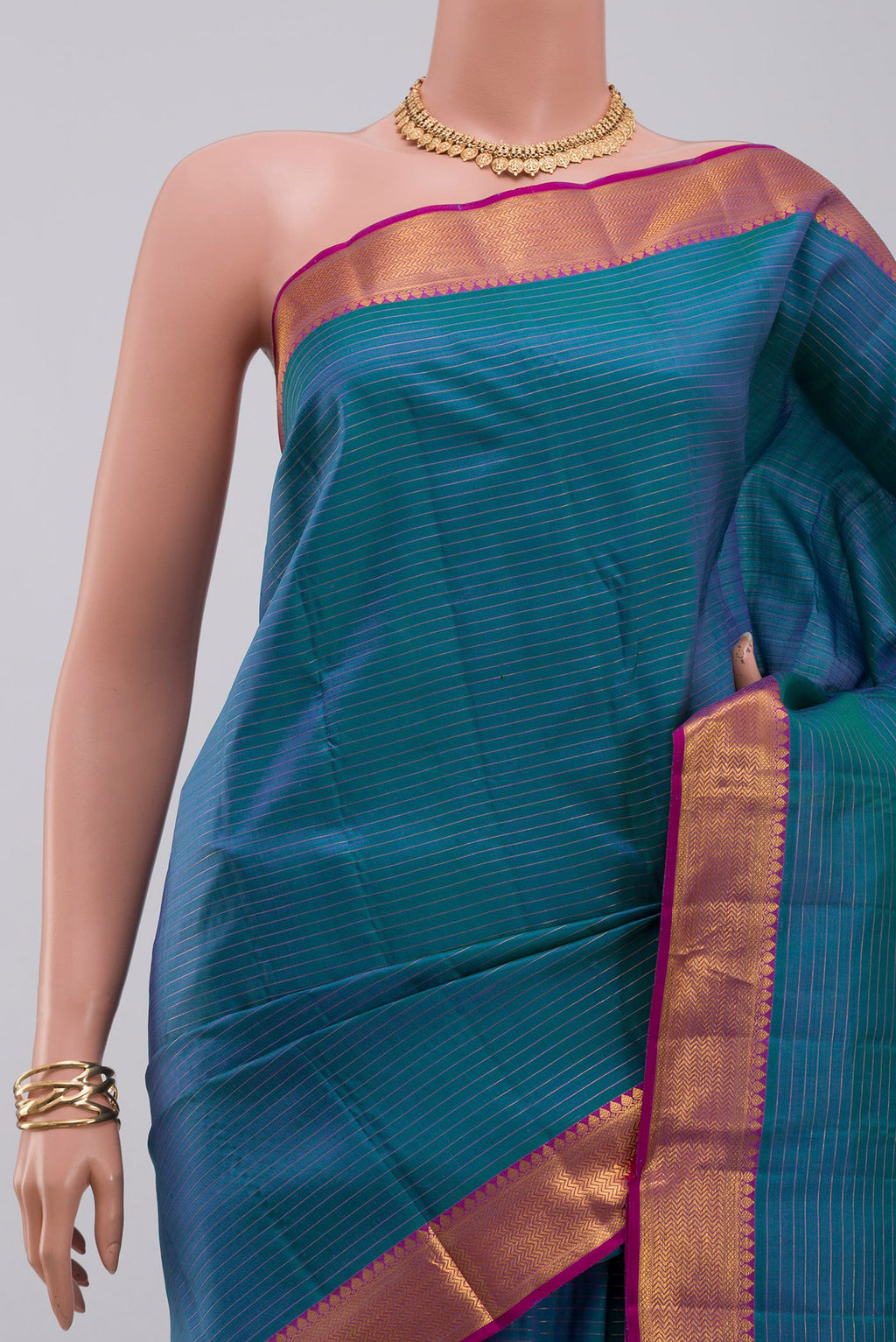 Border image of Blue Kanchipuram Silk Saree with Stripes on the body and Zari Border. 