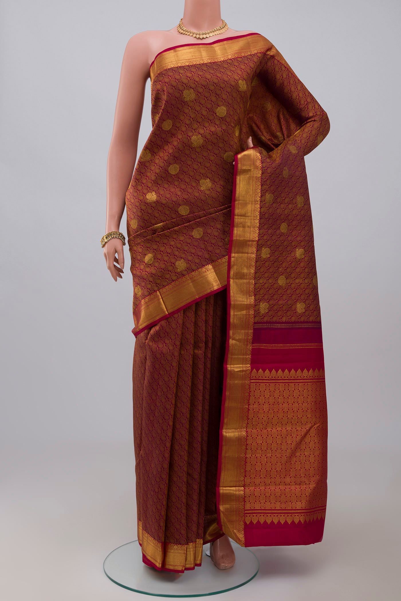 Pure Silk Pure Zari Purple Kanjivaram Saree with Jacquard With Zari Butta on the body and Zari Border.  displayed on a mannequin