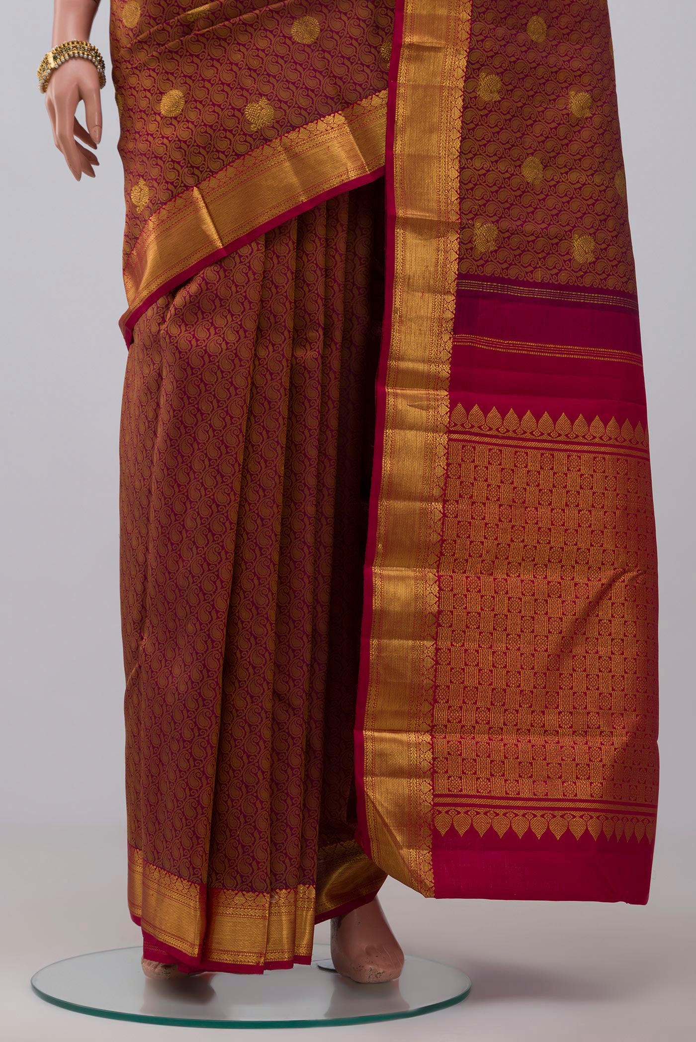 Pleats and pallu of Pure Silk Pure Zari Purple Kanjivaram Saree with Jacquard With Zari Butta on the body and Zari Border. 
