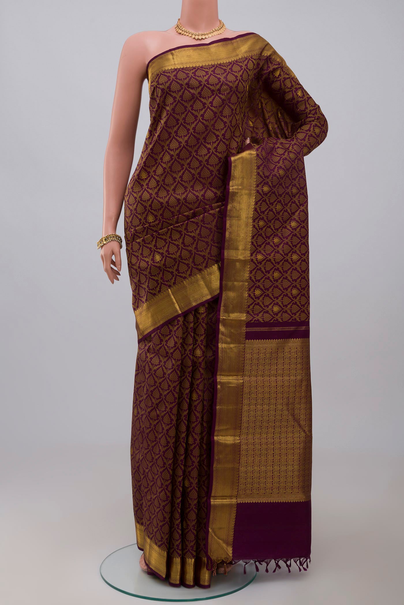 Pure Silk Pure Zari Purple Kanjivaram Saree with Jacquard With Zari Butta on the body and Zari Border.  displayed on a mannequin