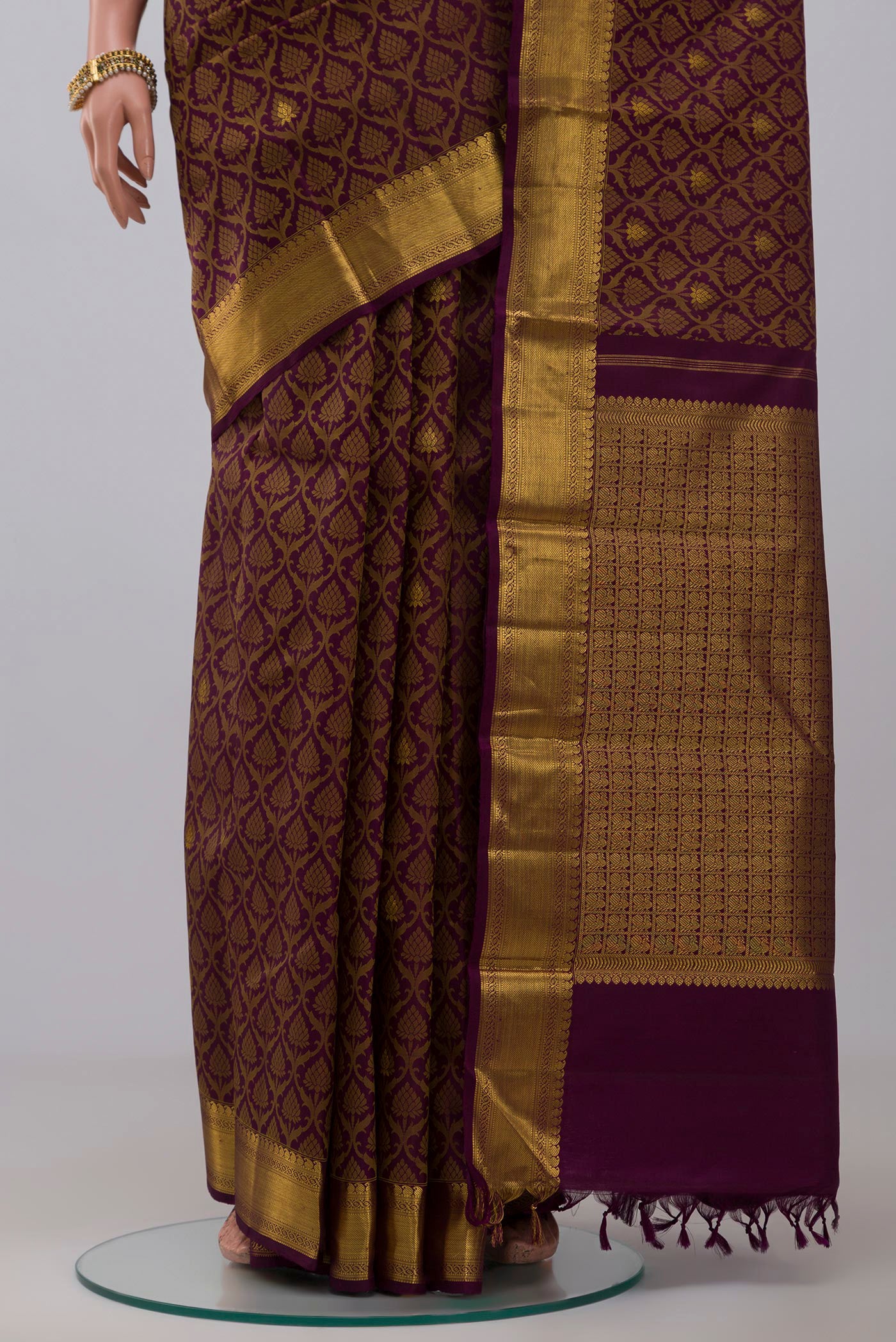Pleats and pallu of Pure Silk Pure Zari Purple Kanjivaram Saree with Jacquard With Zari Butta on the body and Zari Border. 