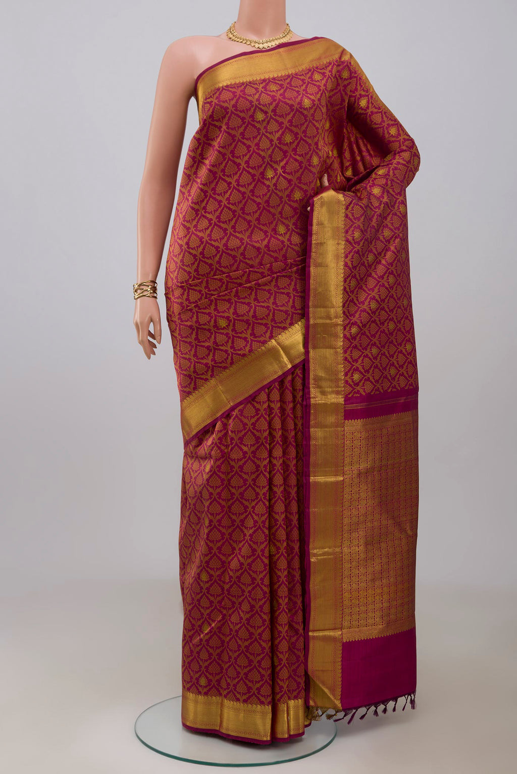 Maroon Kanjivaram Silk Saree with Jacquard With Zari Butta on the body and Zari Border.  displayed on a mannequin