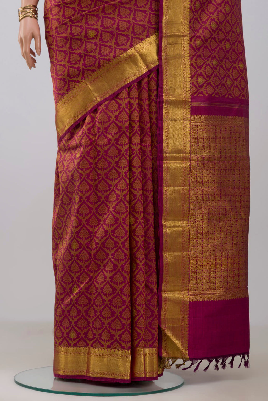Pleats and pallu of Maroon Kanjivaram Silk Saree with Jacquard With Zari Butta on the body and Zari Border. 