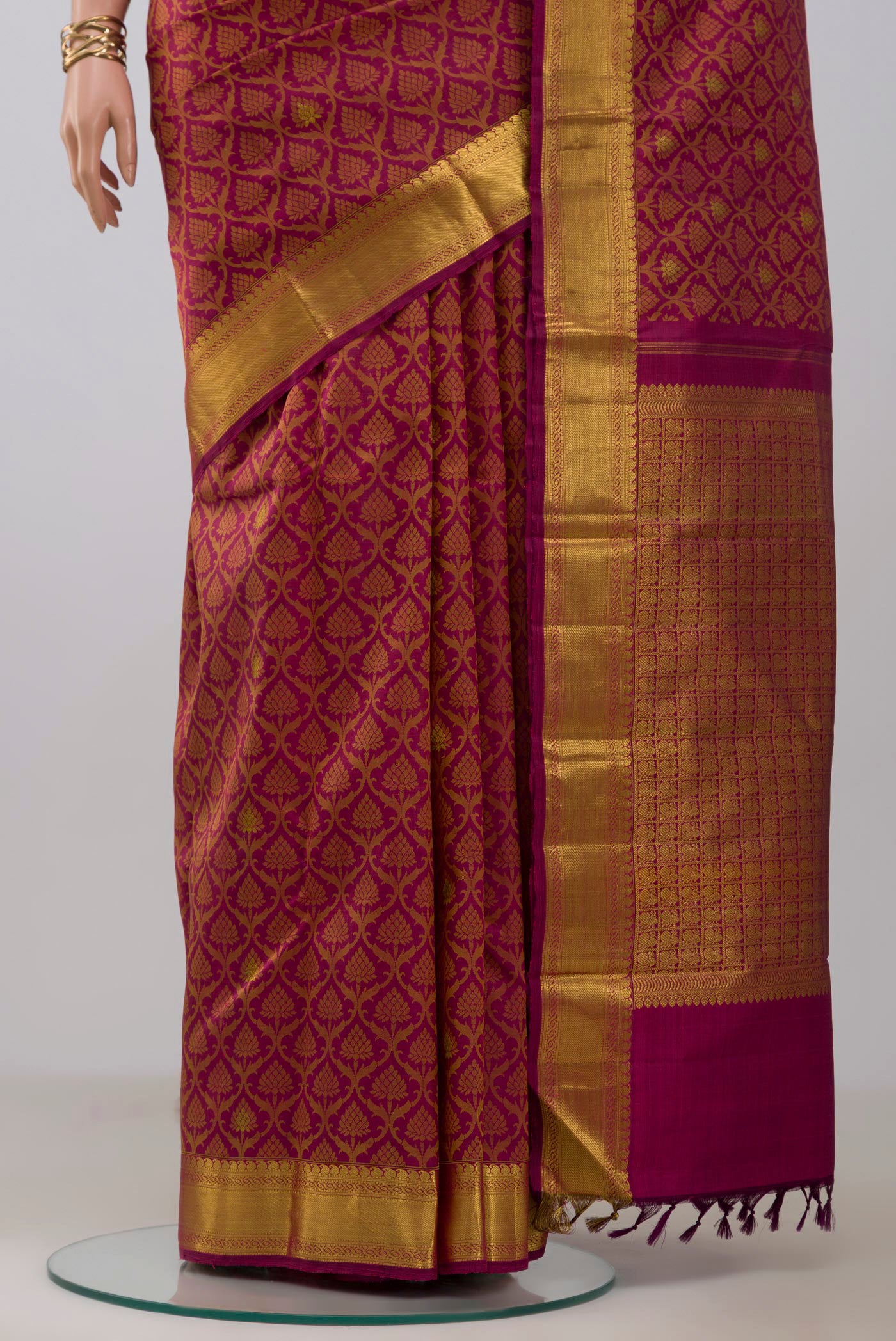 Pleats and pallu of Maroon Kanjivaram Silk Saree with Jacquard With Zari Butta on the body and Zari Border. 