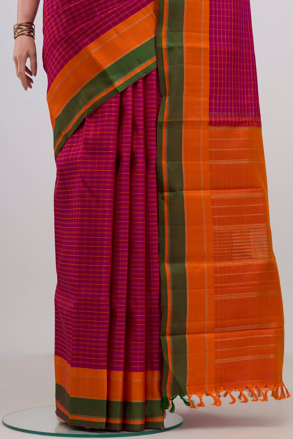 Pleats and pallu of Pure Silk Pure Zari Pink Kanjivaram Saree with Checked design on the body and Plain Border. 
