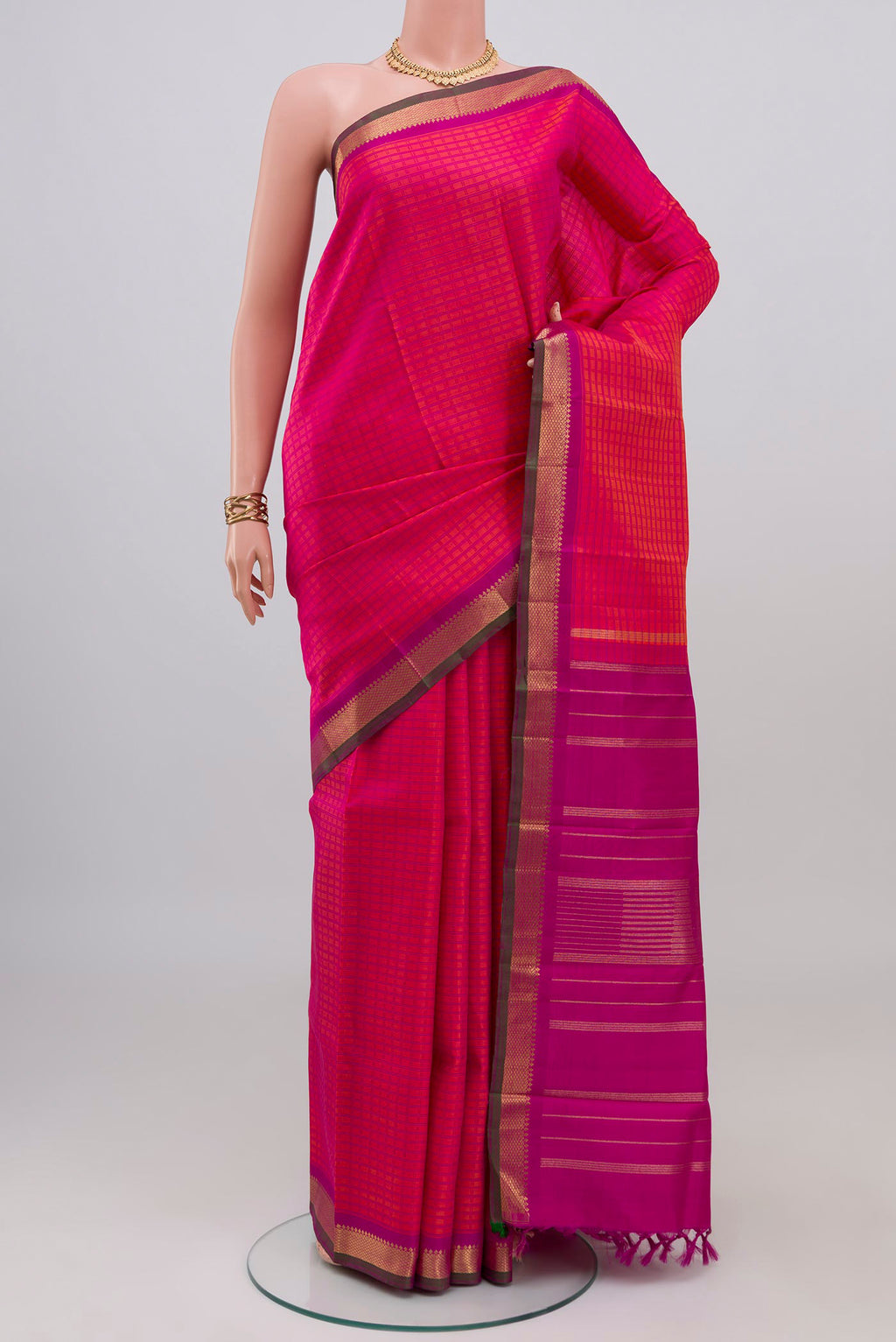 Pink Dual Tone Kanjivaram Silk Saree with Checked design on the body and Zari Border.  displayed on a mannequin