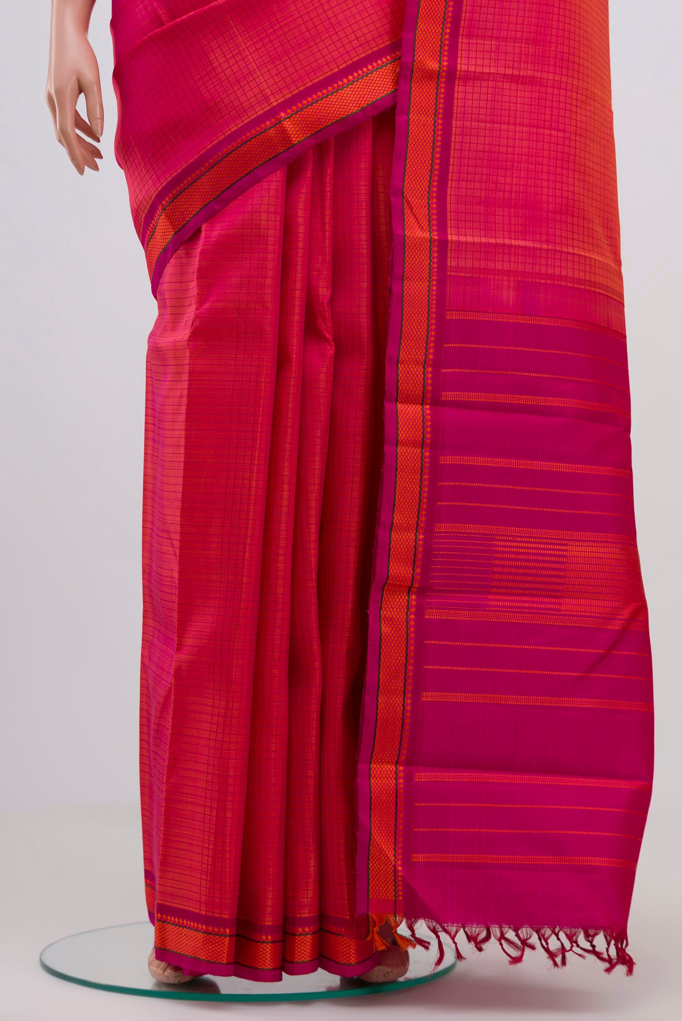 Pleats and pallu of Orange Dual Tone Kanjivaram Silk Saree with Thread Brocade on the body and Thread Border. 