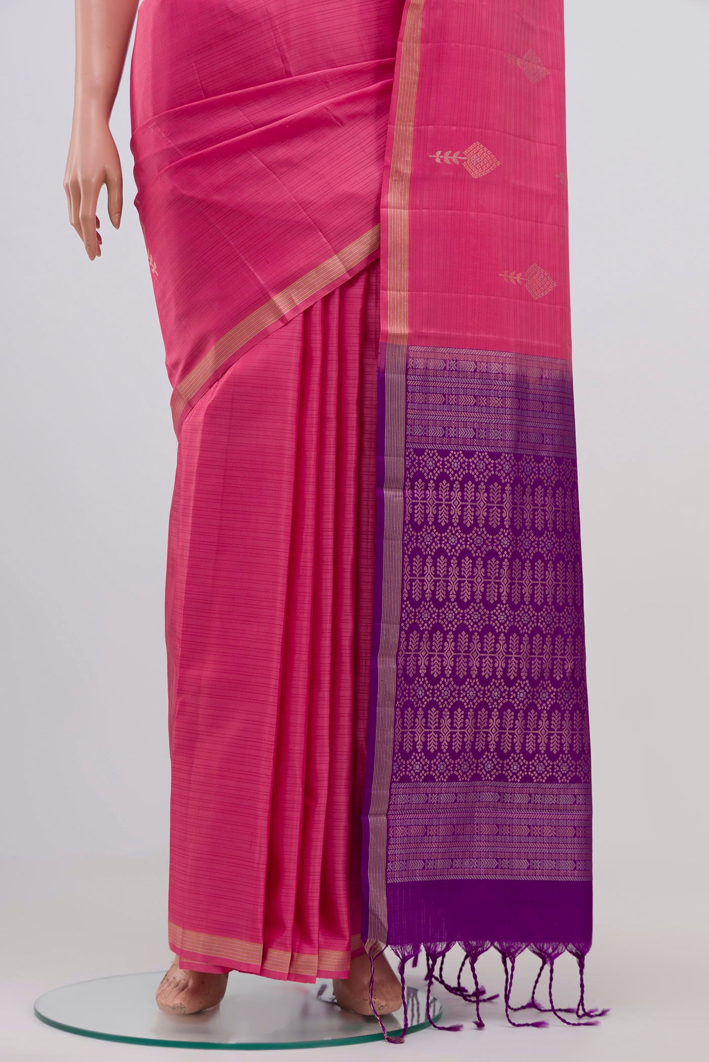Pleats and pallu of Pink Kanjivaram Silk Saree with Zari Butta on the body and Zari Border. 