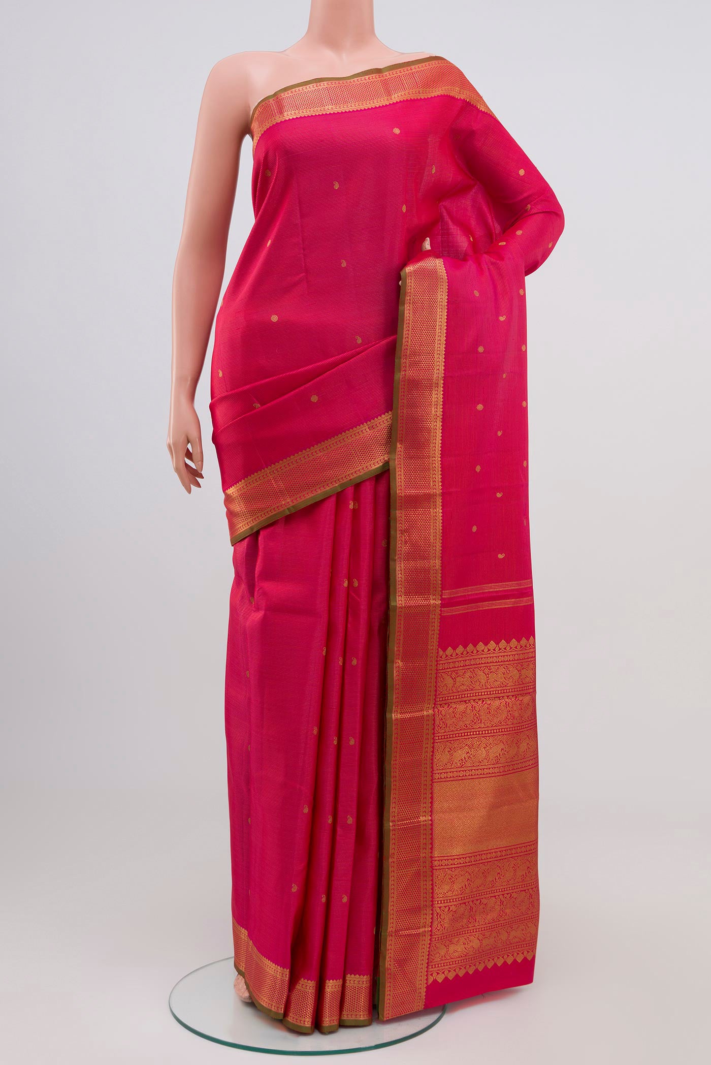 Pure Silk Pure Zari Pink Kanjivaram Saree with Stripes on the body and Zari Border.  displayed on a mannequin