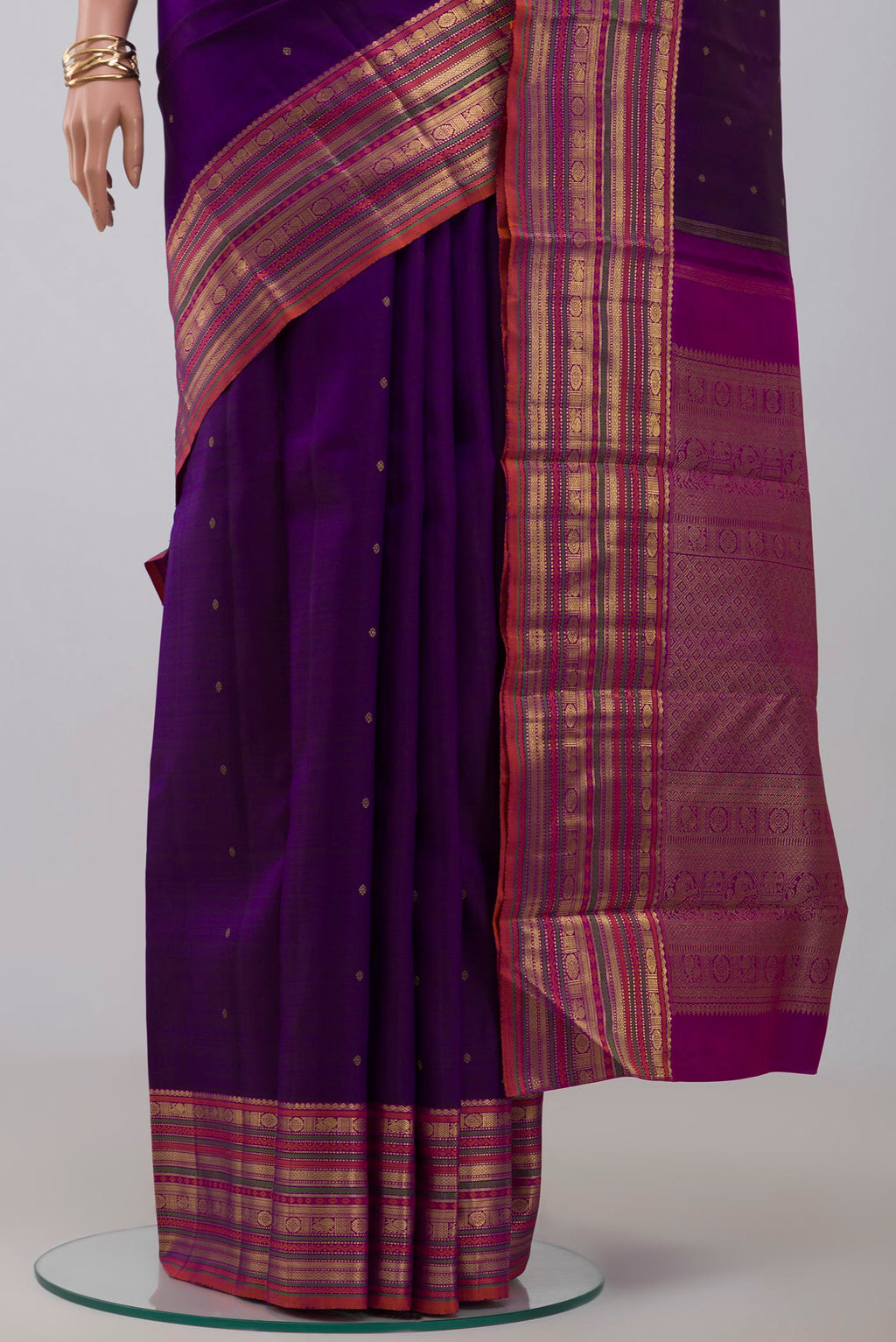 Pleats and pallu of Pure Silk Pure Zari Purple Kanjivaram Saree with Zari Butta on the body and Zari Border. 