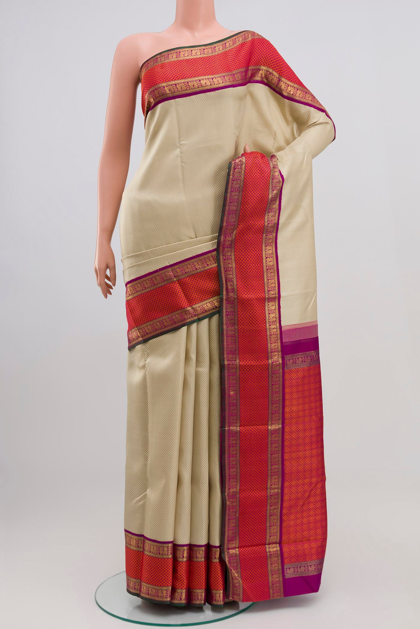 Pure Silk Pure Zari Cream Kanchipuram Saree with Jacquard design on the body and Zari Border.  displayed on a mannequin