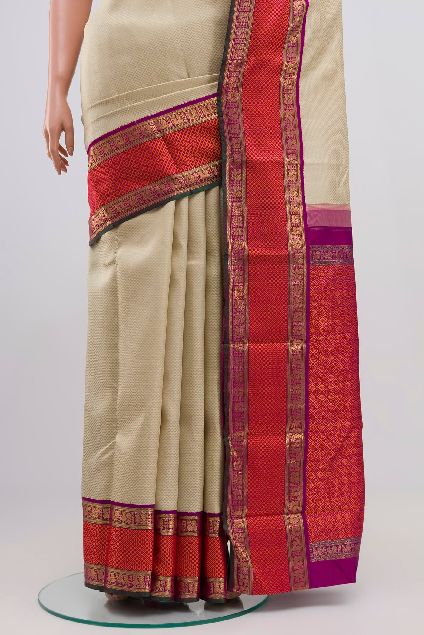 Pleats and pallu of Pure Silk Pure Zari Cream Kanchipuram Saree with Jacquard design on the body and Zari Border. 