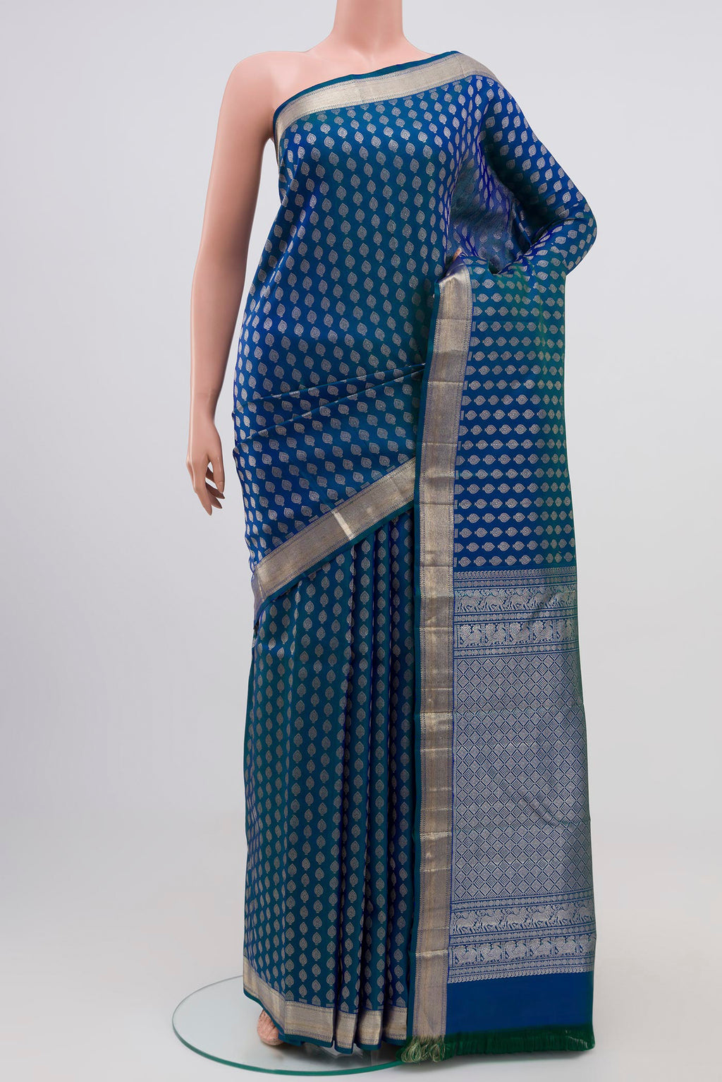 Pure Silk Pure Zari Blue Dual Tone Kanchipuram Saree with Zari Brocade on the body and Zari Border.  displayed on a mannequin