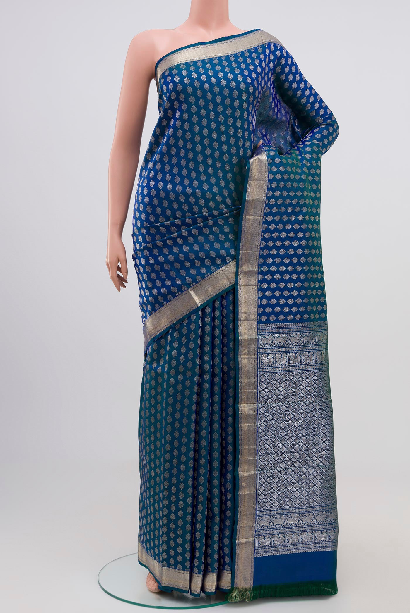 Pure Silk Pure Zari Blue Dual Tone Kanchipuram Saree with Zari Brocade on the body and Zari Border.  displayed on a mannequin