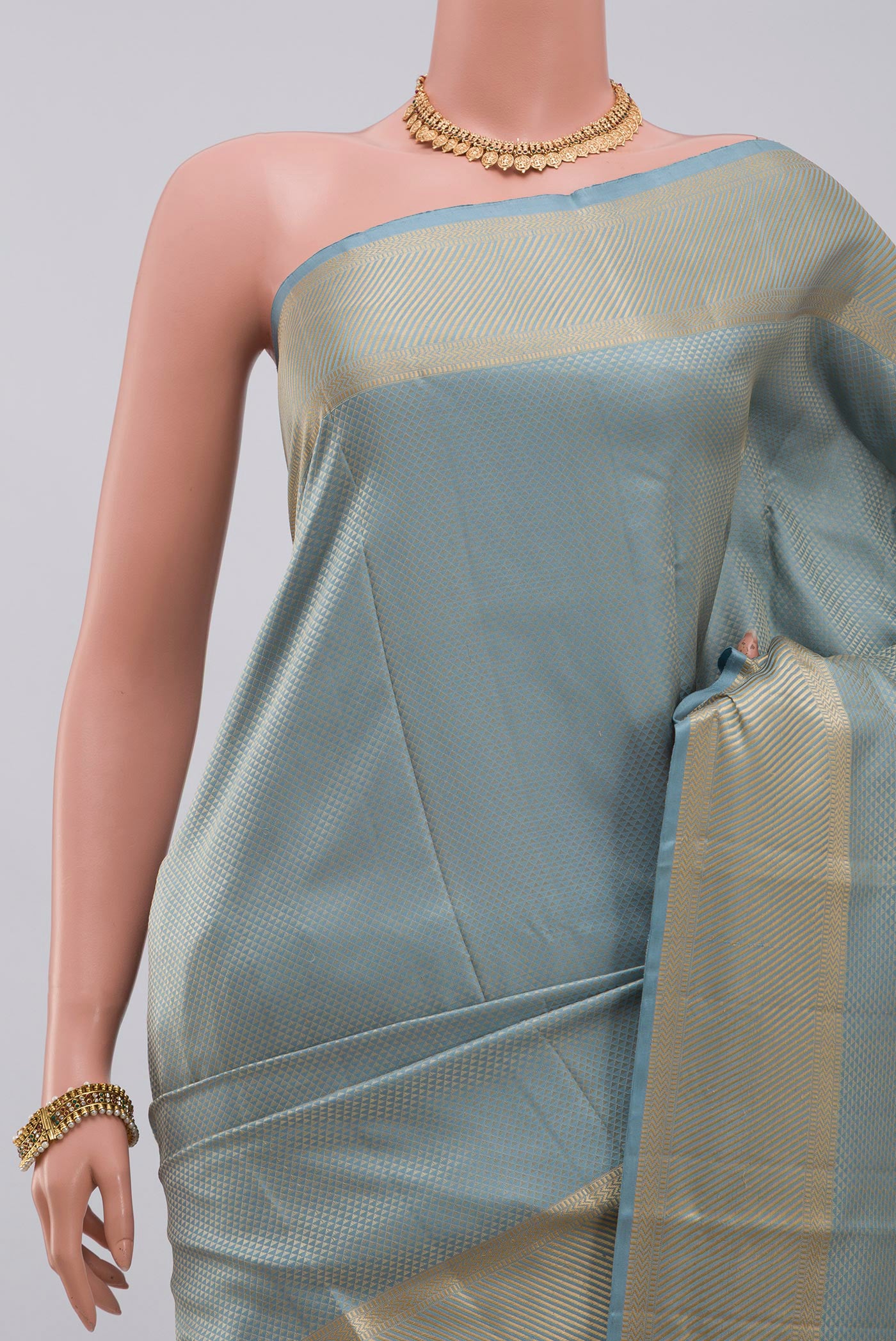 Border image of Sky Blue Kanchipuram Silk Saree with Jacquard design on the body and Thread Border. 