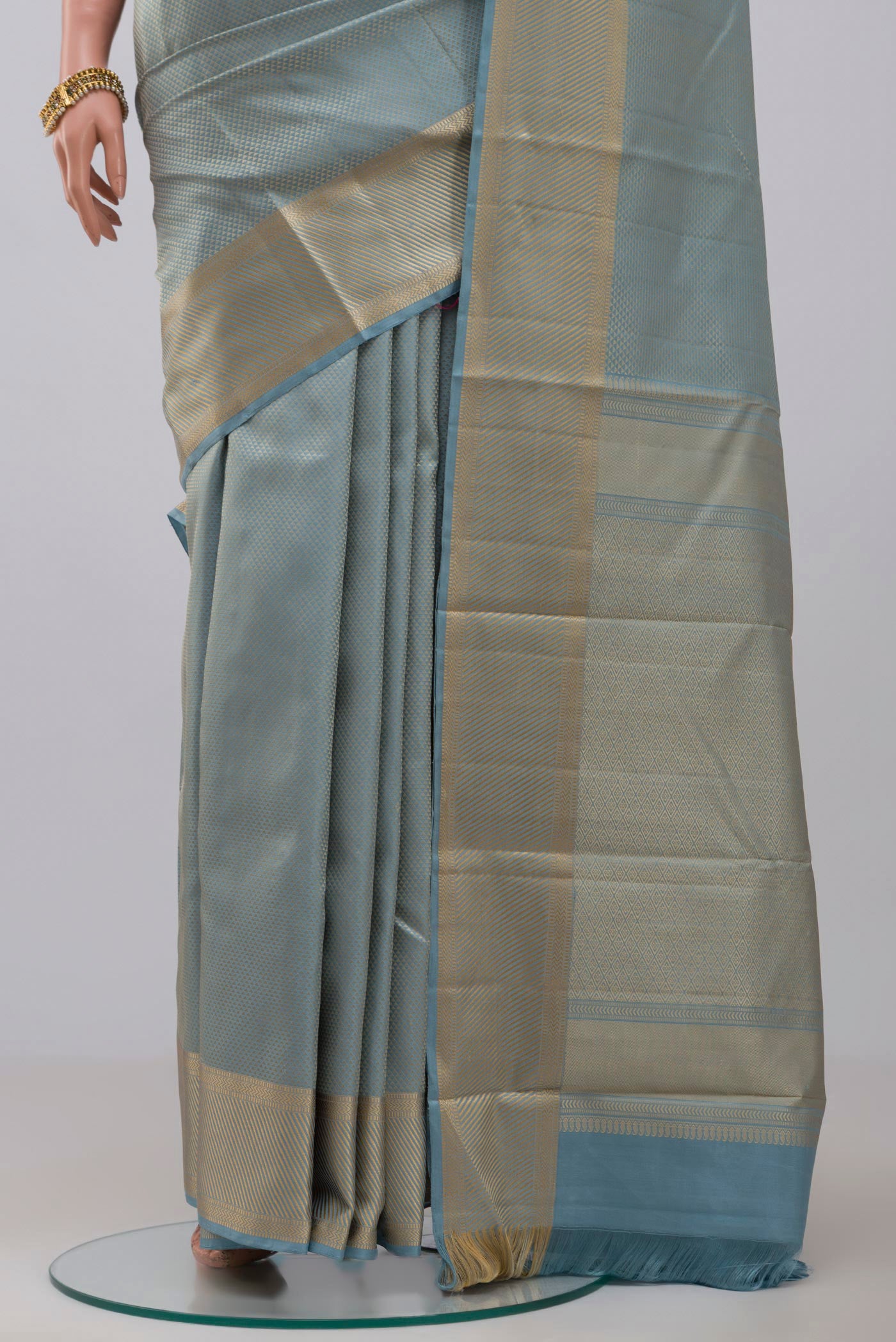 Pleats and pallu of Sky Blue Kanchipuram Silk Saree with Jacquard design on the body and Thread Border. 