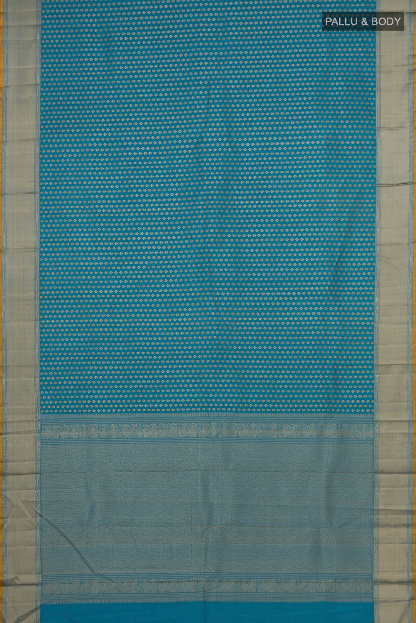 Flat view of Blue Kanchipuram Silk Saree with Thread Butta on the body and Thread Border. 