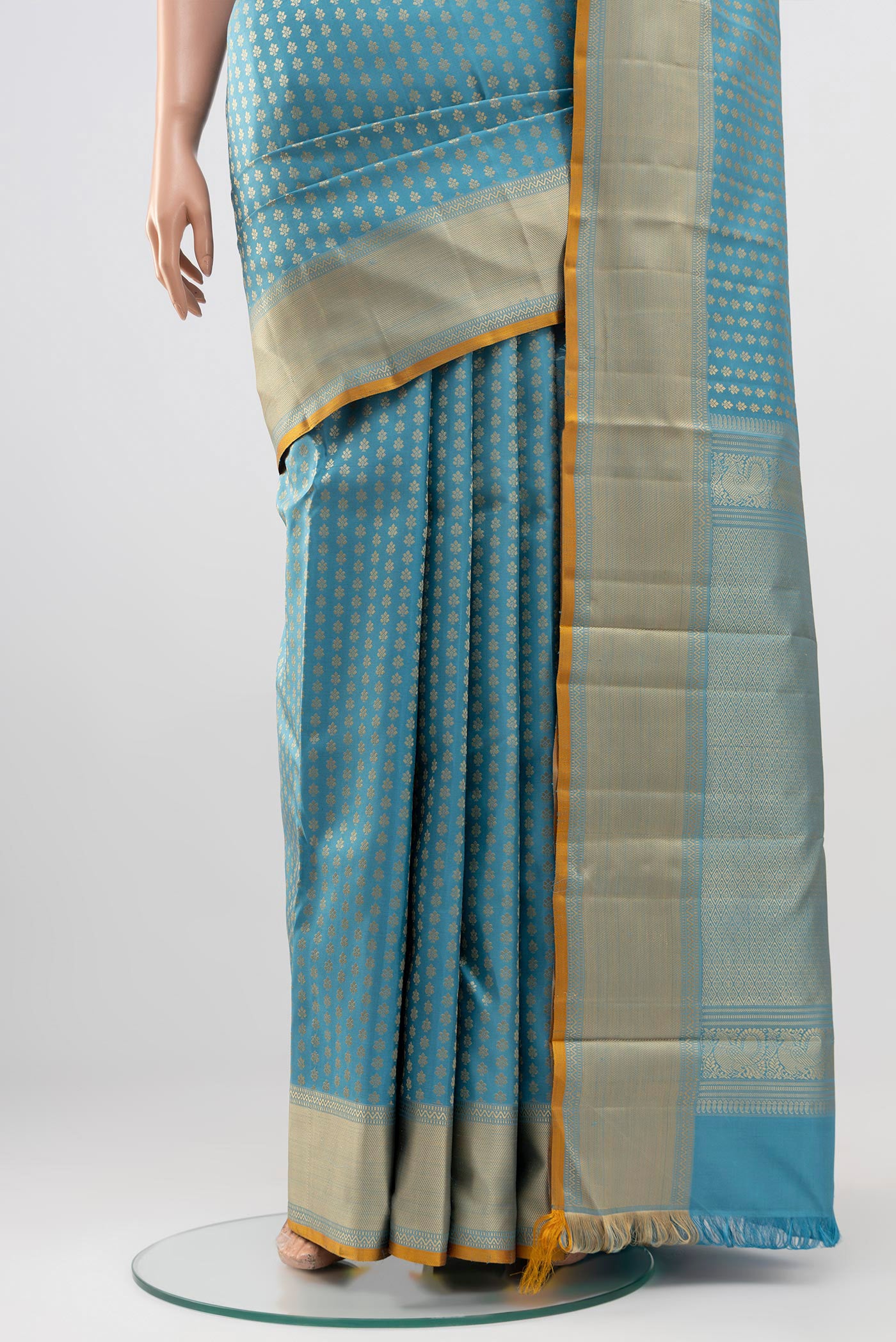 Pleats and pallu of Blue Kanchipuram Silk Saree with Thread Butta on the body and Thread Border. 