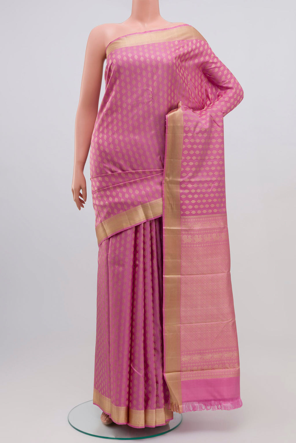 Pink Kanchipuram Silk Saree with Thread Brocade on the body and Thread Border.  displayed on a mannequin