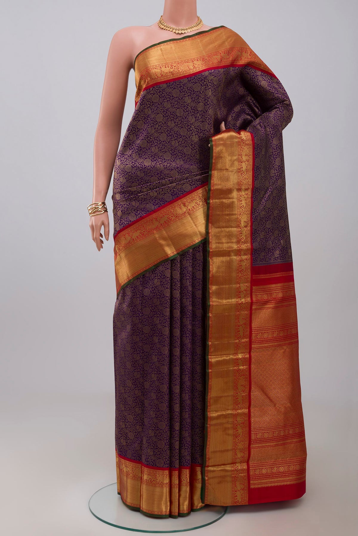 Dark Blue Kanjivaram Saree with Zari Brocade on the body and Zari Border.  displayed on a mannequin