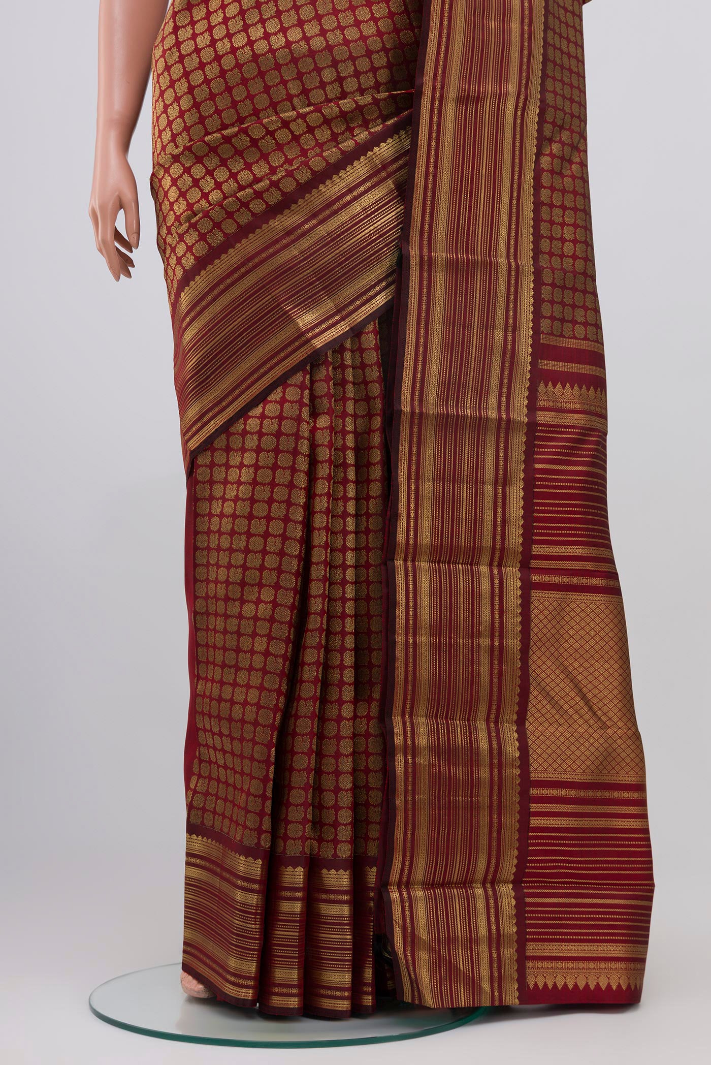Pleats and pallu of Pure Silk Pure Zari Maroon Kanjivaram Saree with Zari Brocade on the body and Zari Border. 