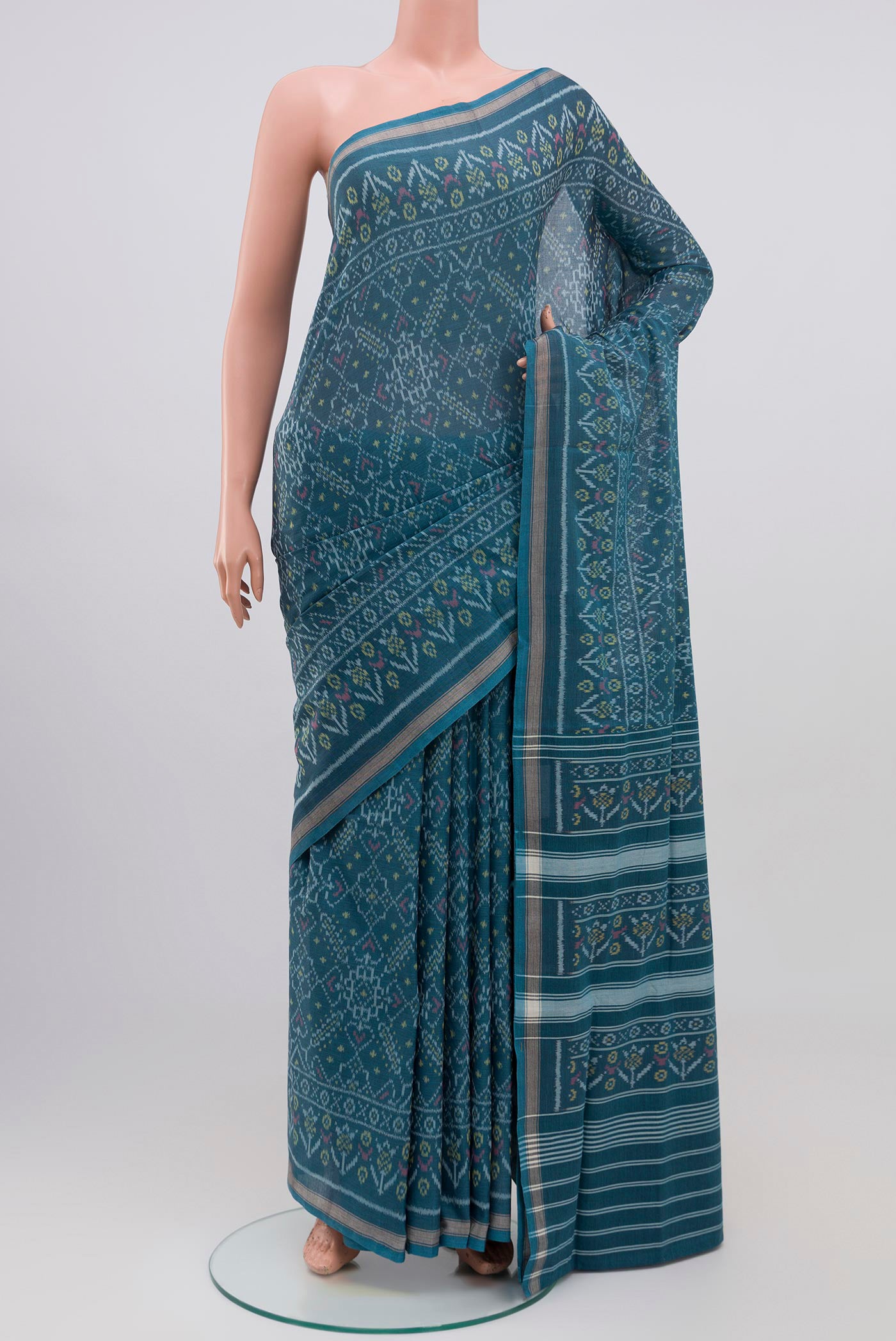 Blue Grey Double Ikat Saree with Ikat design on the body and Plain Border.  displayed on a mannequin
