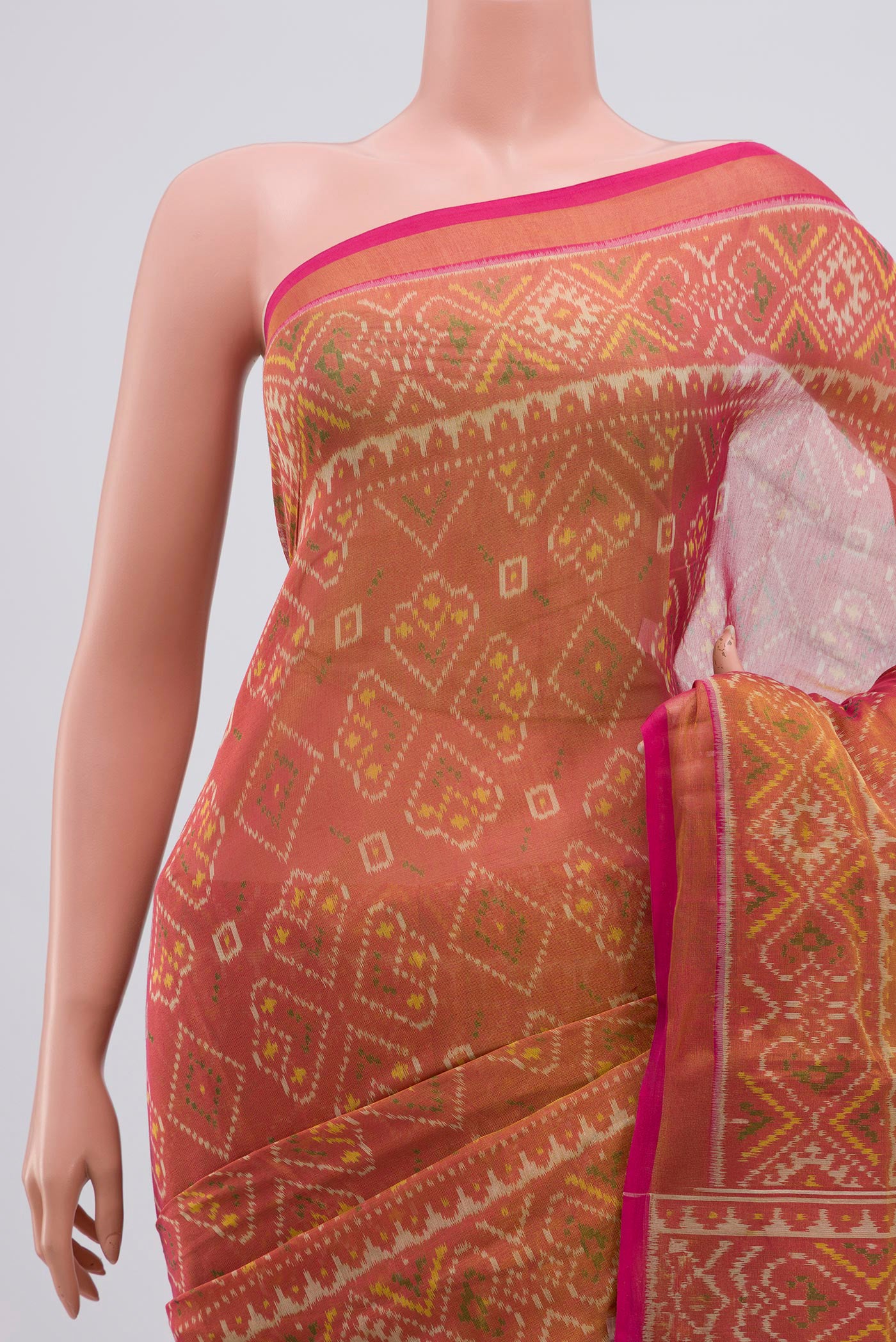 Border image of Golden Double Ikat Saree with Ikat design on the body and Zari Border. 