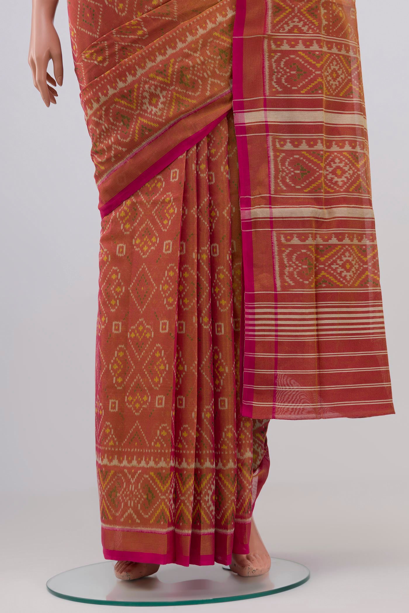Pleats and pallu of Golden Double Ikat Saree with Ikat design on the body and Zari Border. 