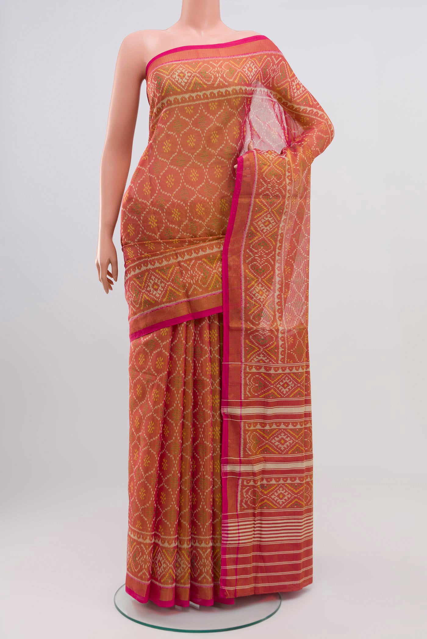 Pink Rajkot Patola Silk Saree with Ikat design on the body and Zari Border.  displayed on a mannequin