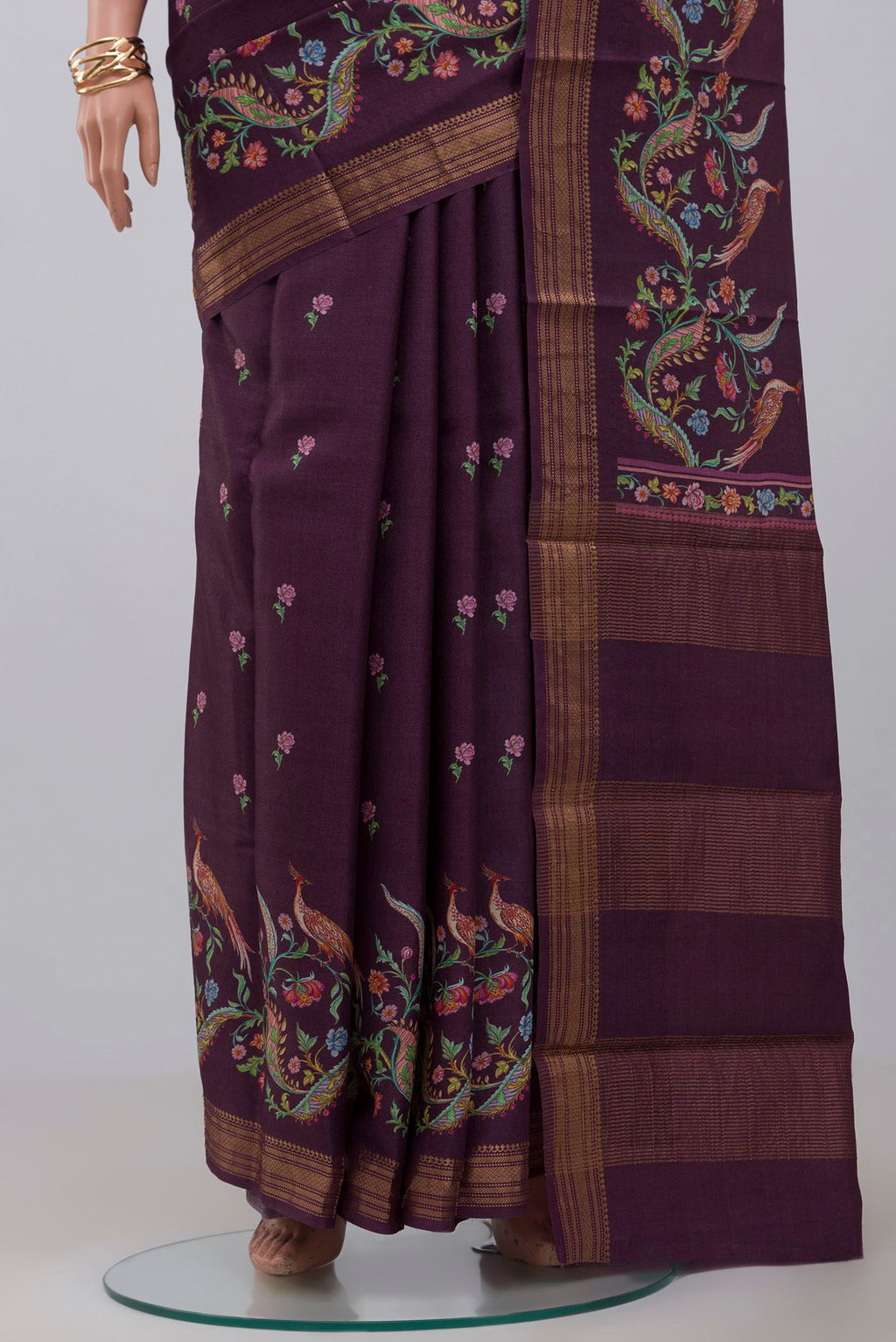 Pleats and pallu of Purple Tussar Saree with Fancy on the body and Zari Border. 
