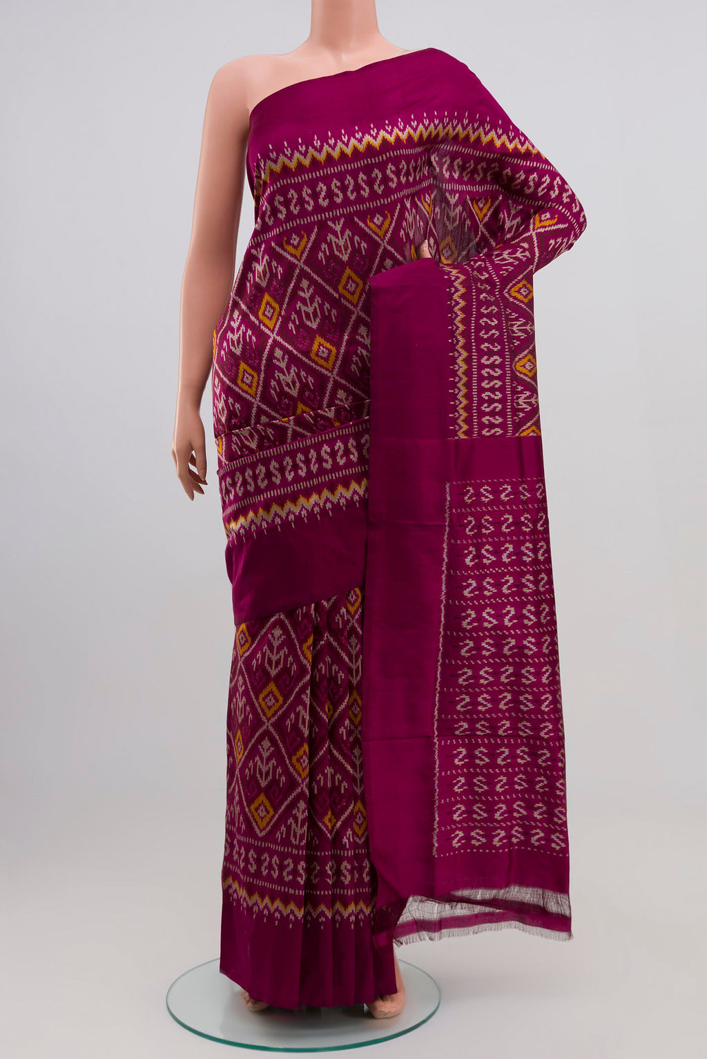 Purple Pochampally Silk Saree with Ikat Print on the body and Plain Border.  displayed on a mannequin