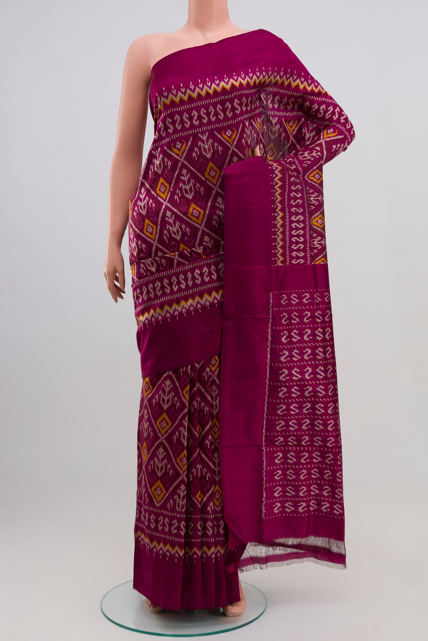 Purple Pochampally Silk Saree with Ikat Print on the body and Plain Border.  displayed on a mannequin
